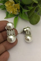 Kitashi ad earrings