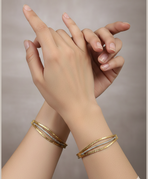 Show these bangles on model wrist with beautiful hands , according to size 2.4, studio background with professional photography