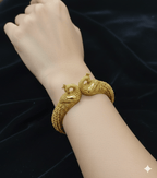 Ethnic Peacock Inspired Designer Kada Bangles by Aganya Kreation — pair of pure brass kadas with intricate peacock motif temple design and antique finish, openable clasp, size 2.6 shown