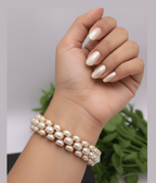 Svadhiti Real Pearl Bangles by Aganya Kreation — handcrafted 22k gold-plated pure brass bangle pair with unique genuine freshwater pearls, size 2.4 shown