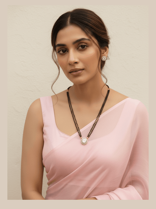 Jennifer Solitaire Mangalsutra with AAA+ zirconia pendant in gold plated copper alloy by Aganya Kreation
