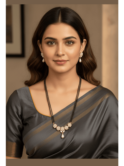 Real Pearl Kamakhaya Mangalsutra Set by Aganya Kreation — gold-plated pure brass mangalsutra with genuine freshwater pearls, CZ stones and matching earrings, satin white variant shown