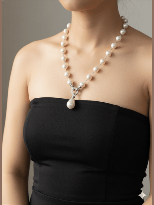 Omya Shell Pearl Mala with rhodium finish and American diamond teardrop pendant by Aganya Kreation