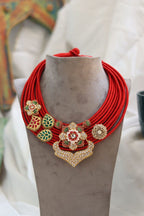 Vaishavi Necklace with kundan, carved stones, and cotton thread in antique finish by Aganya Kreation
